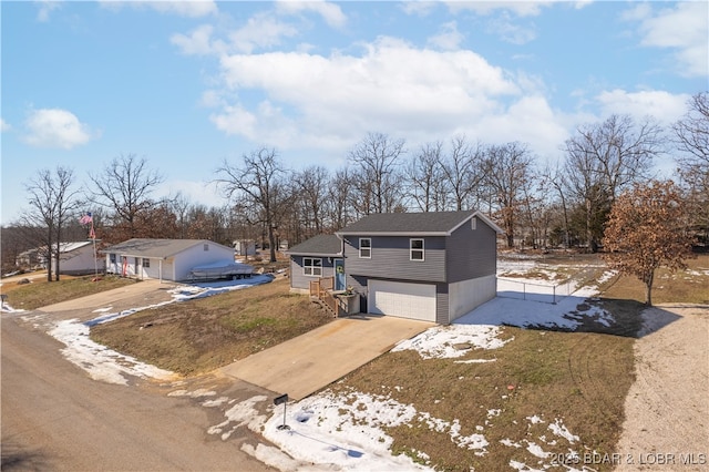 view of front facade featuring a garage and concrete driveway