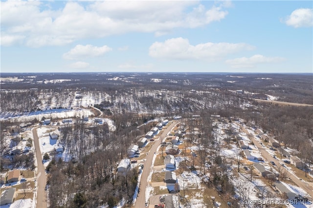 snowy aerial view featuring a residential view