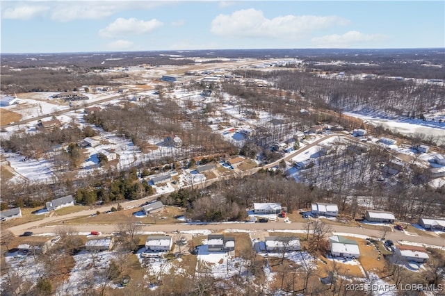 snowy aerial view with a residential view