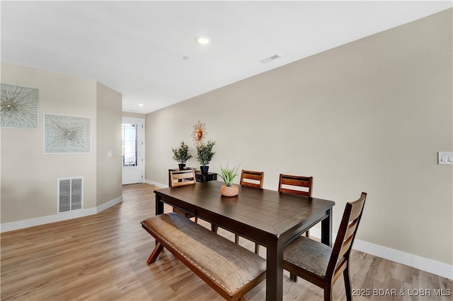 182 Vintage Dr Unit 4H, Lake Ozark, MO 65049 - dining area with light wood-style flooring, visible vents, and baseboards