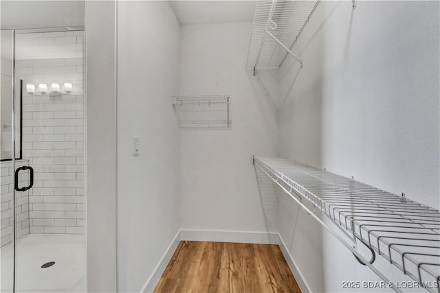 182 Vintage Dr Unit 4H, Lake Ozark, MO 65049 - spacious closet featuring wood finished floors