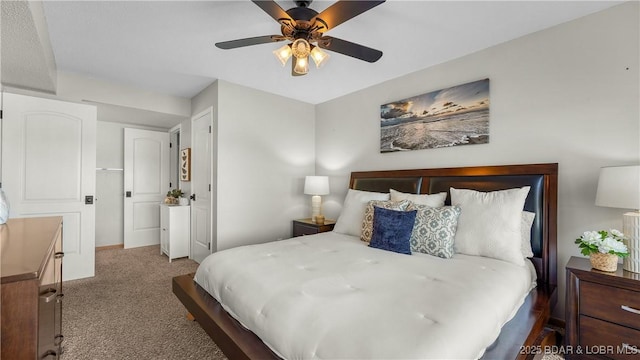 bedroom with dark carpet and a ceiling fan