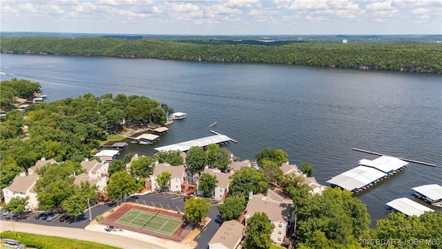 aerial perspective of suburban area featuring a nearby body of water
