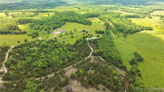 bird's eye view with a rural view and a view of trees