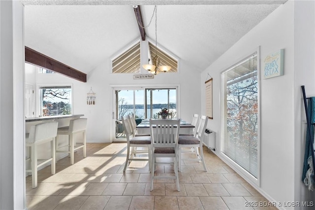 dining room featuring vaulted ceiling with beams, a textured ceiling, baseboards, and light tile patterned floors