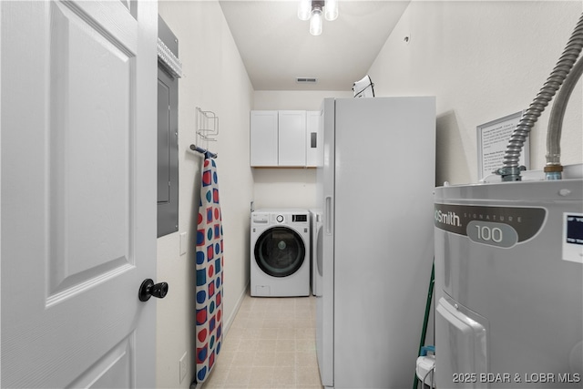 washroom featuring visible vents, washing machine and dryer, and cabinet space