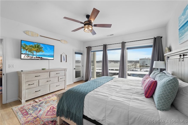 bedroom featuring light wood finished floors, visible vents, a ceiling fan, access to outside, and baseboards