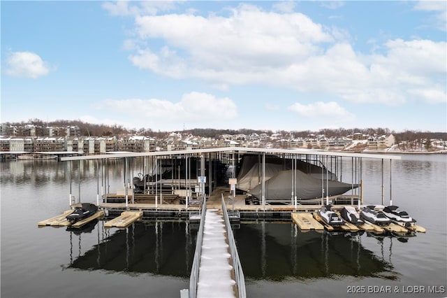 dock area with a water view and boat lift