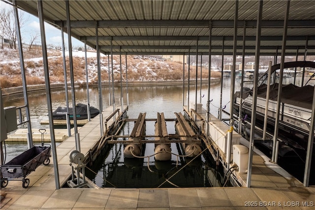 view of dock featuring a water view and boat lift