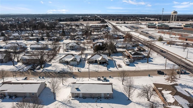 snowy aerial view with a residential view