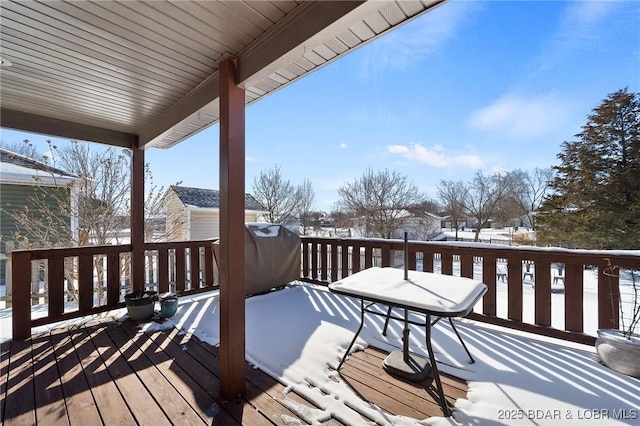 view of snow covered deck