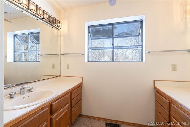 bathroom featuring visible vents and vanity