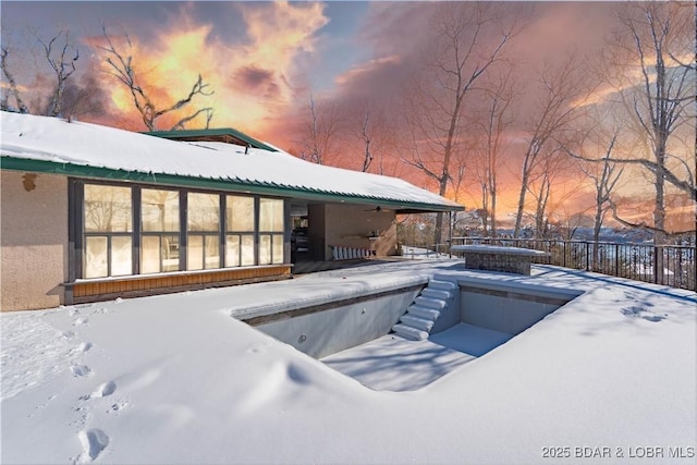 view of snow covered pool