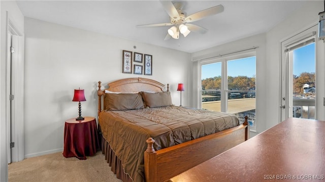 bedroom with light carpet, baseboards, a ceiling fan, and access to exterior