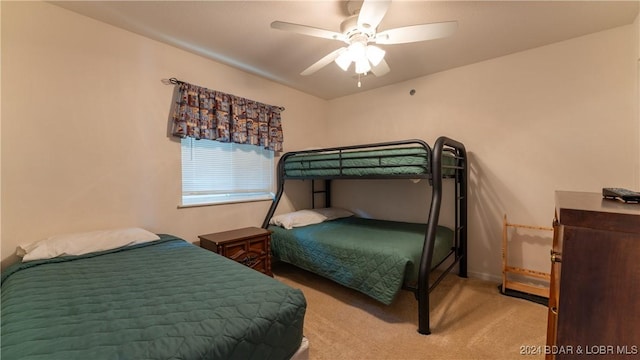 bedroom with light colored carpet and ceiling fan