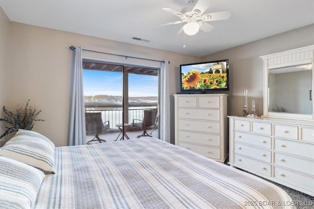 bedroom featuring access to outside, visible vents, and a ceiling fan