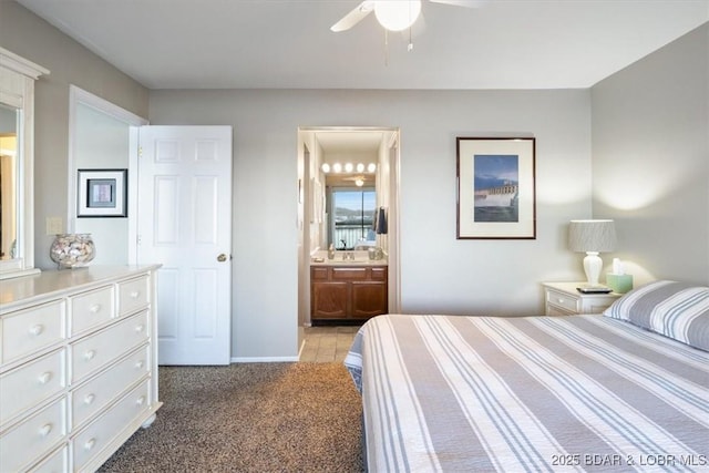 bedroom with light carpet, baseboards, a ceiling fan, and connected bathroom