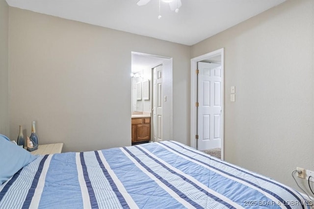 bedroom featuring a ceiling fan and connected bathroom