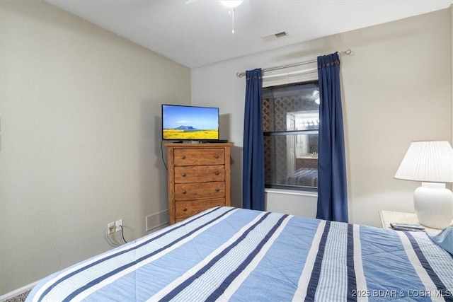 bedroom with a ceiling fan and visible vents