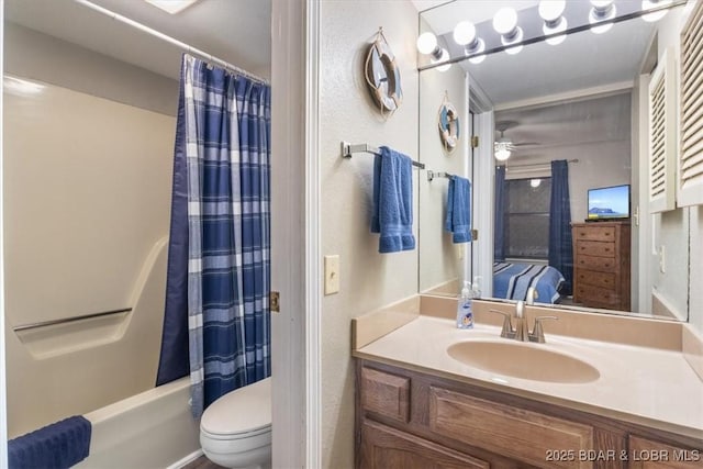 full bathroom with vanity, ceiling fan, shower / bath combo with shower curtain, and toilet