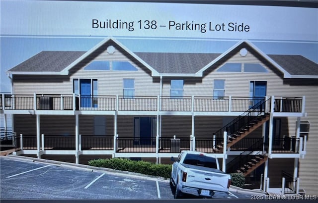 exterior space featuring uncovered parking and stairway