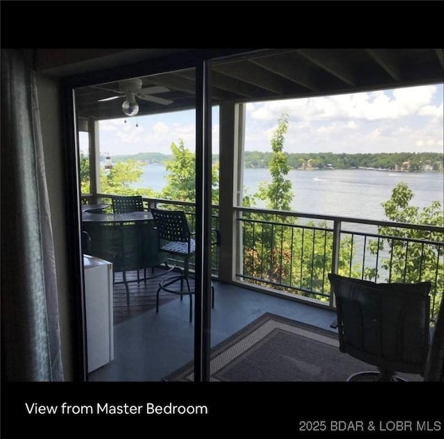 balcony featuring a water view