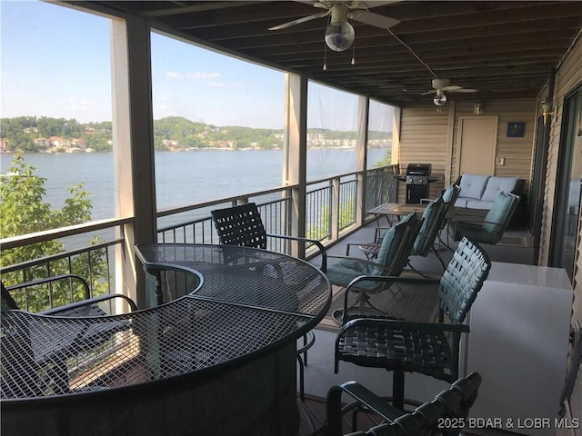 wooden deck featuring a water view, grilling area, and a ceiling fan