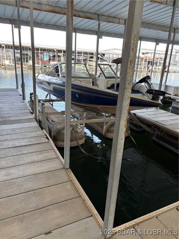 152 Falls Point Dr Unit 1A, Lake Ozark, MO 65049 - dock area with a water view and boat lift