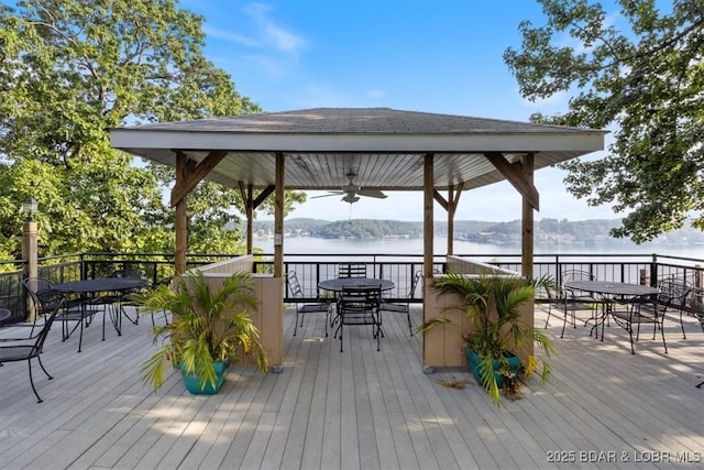 152 Falls Point Dr Unit 1A, Lake Ozark, MO 65049 - wooden deck with outdoor dining space, a gazebo, and a water view