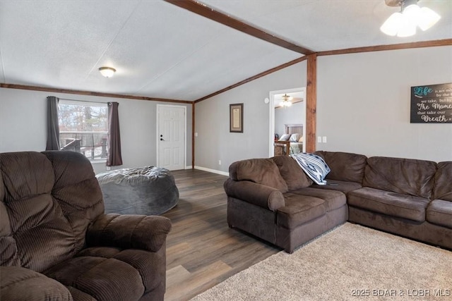 living room with crown molding, lofted ceiling with beams, ceiling fan, wood finished floors, and baseboards