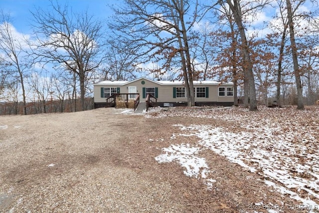 manufactured / mobile home featuring a wooden deck