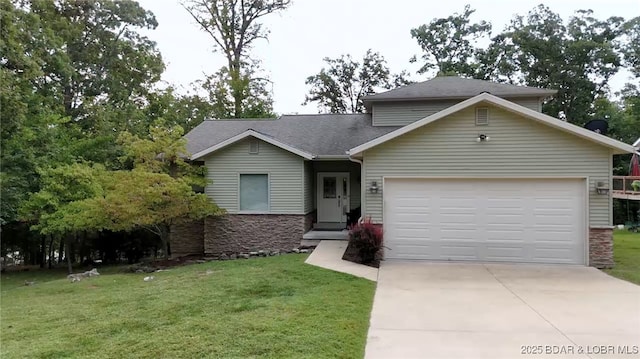 view of front of house with a shingled roof, an attached garage, stone siding, driveway, and a front lawn