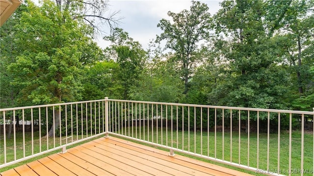 wooden terrace with a yard