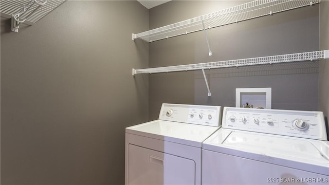 washroom with laundry area and washer and clothes dryer