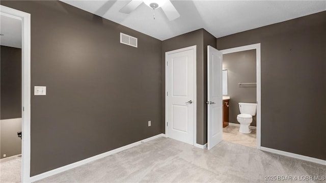 unfurnished bedroom with light carpet, baseboards, and visible vents