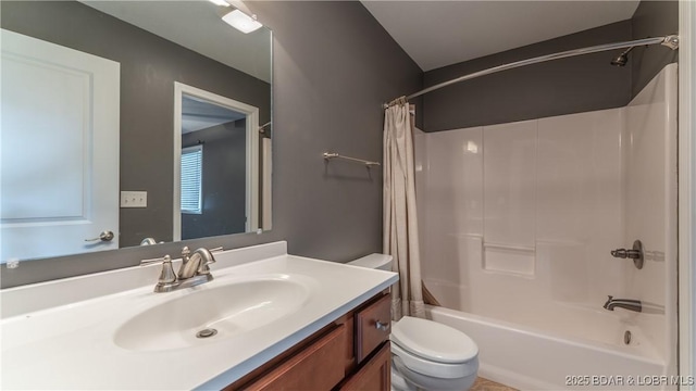 bathroom with toilet, shower / tub combo, and vanity