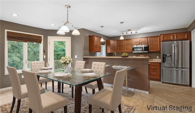 dining area with recessed lighting, baseboards, and light tile patterned floors