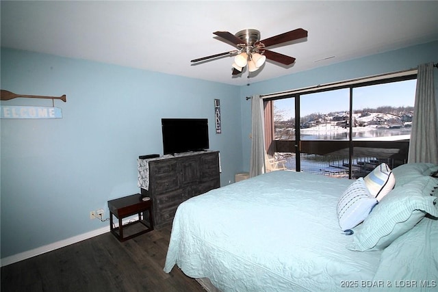 bedroom featuring access to exterior, a ceiling fan, baseboards, and dark wood-type flooring