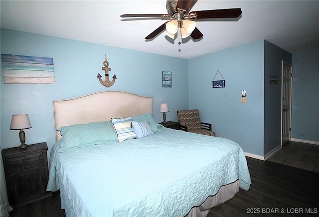 bedroom featuring dark wood-type flooring, baseboards, and a ceiling fan