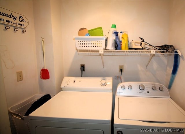 laundry area featuring laundry area and washer and clothes dryer