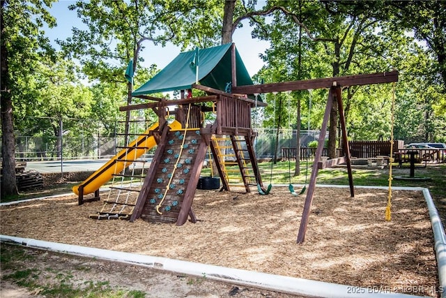 community jungle gym with fence