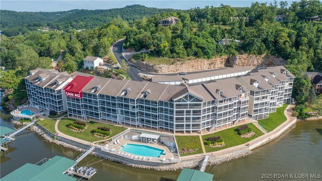 birds eye view of property with a water view