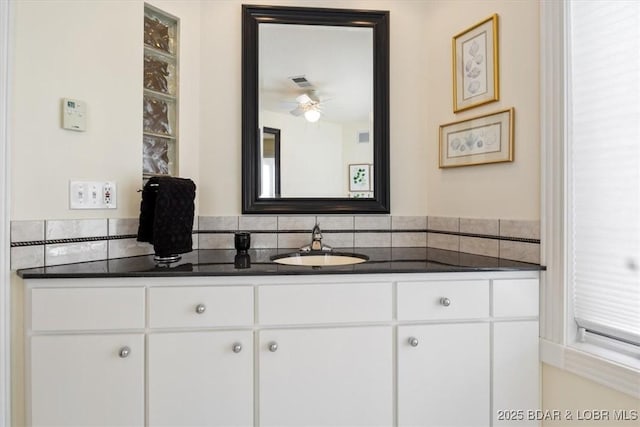 bathroom featuring ceiling fan, visible vents, and vanity