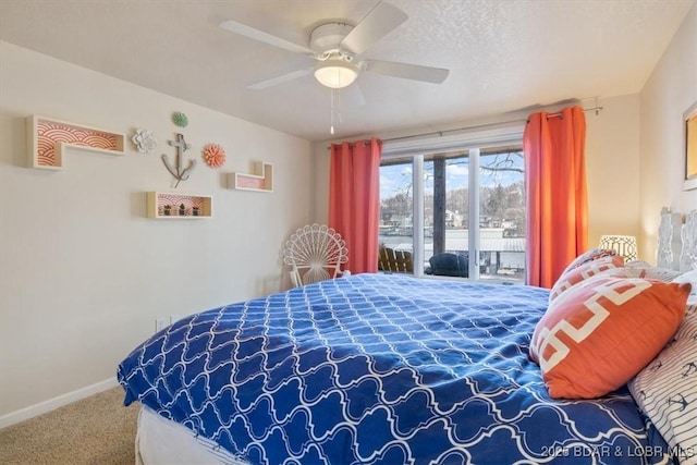 bedroom with carpet, a ceiling fan, a textured ceiling, access to outside, and baseboards