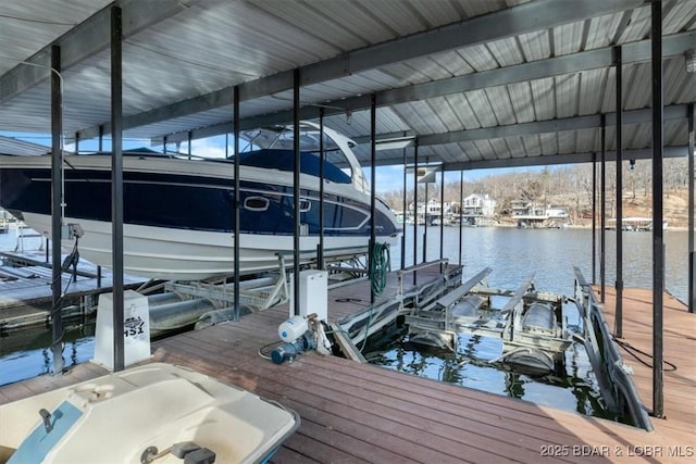 view of dock with a water view and boat lift