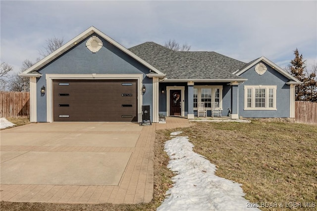 single story home featuring a garage, concrete driveway, fence, and stucco siding