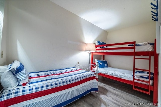 bedroom with wood finished floors