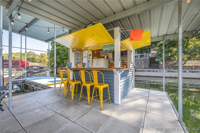 view of patio with an outdoor bar