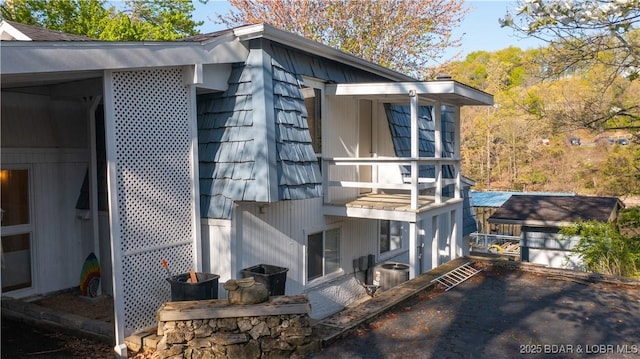 back of house with central air condition unit