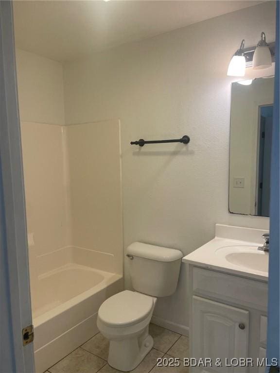 bathroom featuring toilet, vanity, bathtub / shower combination, and tile patterned floors